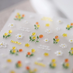 3D embossed tulip nail stickers with frosted gold accents and daisy floral designs