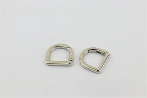 Close-up of dual silver spring-gate D-rings for handbag and DIY craft hardware