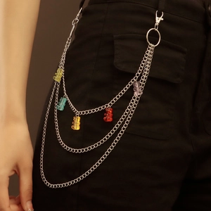 Detail of multi-layer silver metal waist chain featuring five colorful resin bear pendants