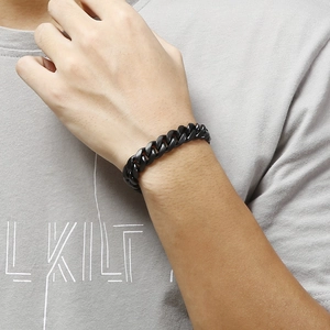 Close-up of a matte black cuban link bracelet worn on a wrist for a modern urban look