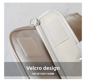 Detail of velcro closure and smooth zipper on the portable cream makeup bag