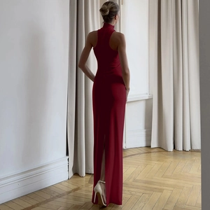 Rear view of slim fit dark red halter neck maxi dress with a stylish back slit detail