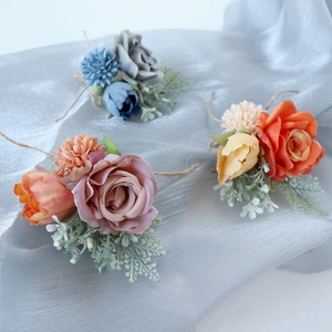 Elegant artificial rose and tulip wedding boutonnieres with twine in three vintage colors