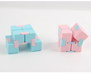 Detail view of pink and blue infinity cube puzzle showing folding and unfolding states