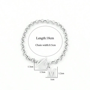 Silver stainless steel heart bracelet with initial M and size chart on white background