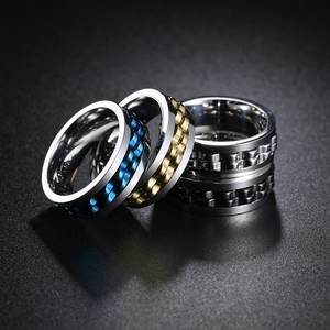 Detail of multi-color spinning gear rings in blue, gold, silver and black stainless steel