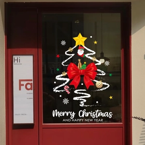 Christmas tree window sticker with red bow, Santa, and stars for holiday glass decor
