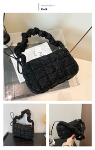 Three-way view of a black quilted handbag featuring elegant ruched cloud-style handles