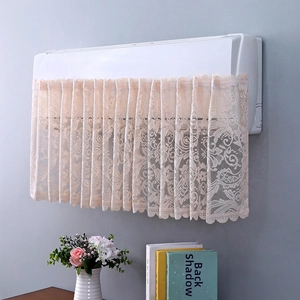 Close-up of light apricot lace air conditioner cover with delicate floral texture