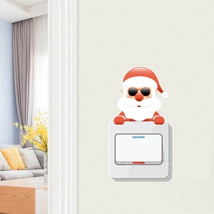 Detailed view of Santa Claus switch sticker on wall in a cozy living room setting
