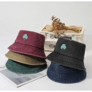 Vintage-style bucket hats featuring embroidered clover detail in multiple retro colors