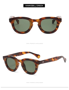 Detail view of tortoiseshell frame sunglasses with dark green lenses in hawksbill finish