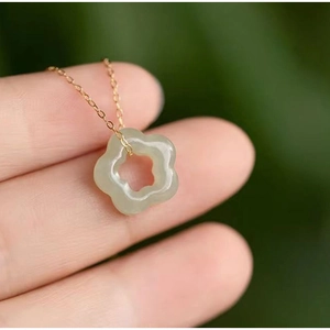 Elegant hollow plum blossom jade pendant necklace in light green with gold chain