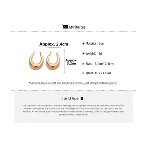 Detailed specs of gold U-shaped iron hoop earrings with silver needles and 3.2cm length