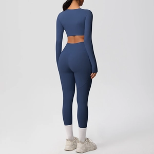 Back view of a deep blue two-piece yoga set showing slim fit long sleeve top and leggings