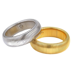 Elastic titanium steel bangles in gold and silver with textured coils and magnetic clasp