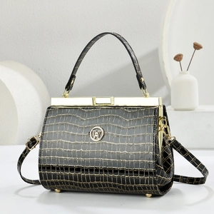 Elegant black faux crocodile skin evening bag with golden hardware and round metal logo
