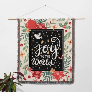 Close-up of Joy to the World Christmas tapestry showing fabric texture and colorful fringe