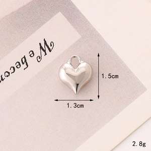 Polished metal heart pendant detail with 1.5cm height measurements for DIY jewelry