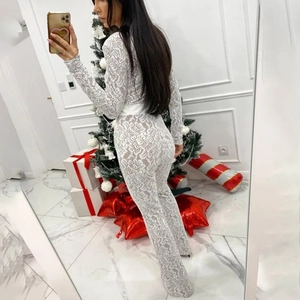 Detailed view of floral lace texture on white long sleeve slim fit bodysuit