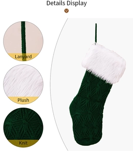 Detail display of green knit Christmas stocking with plush cuff and hanging lanyard