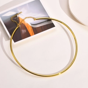 Close-up of polished 18k gold plated stainless steel choker with adjustable chain link