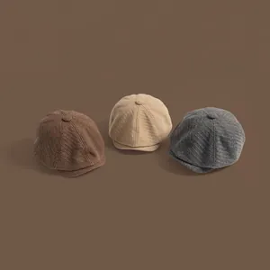 Autumn wool newsboy caps in tan, beige and grey with textured twill and top button
