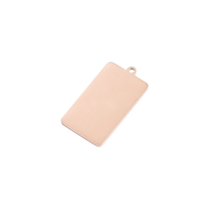 Detailed close-up of a polished rose gold rectangular pendant with a small hanging hole