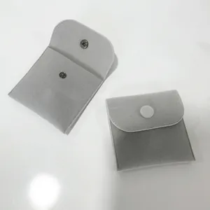 Minimalist light gray velvet jewelry pouch with snap button for rings and earrings