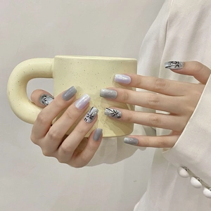 Handmade aurora cat eye press-on nails with wave pattern and hand-painted palm leaf design