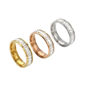 Set of gold, rose gold and silver eternity rings with baguette-cut cubic zirconia stones