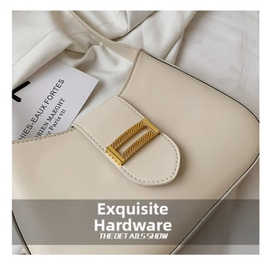 Detail of off-white leather shoulder bag featuring a gold textured rectangular buckle