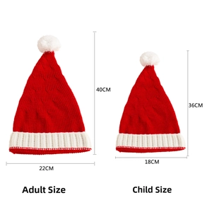 Detailed view of red and white knit Christmas hats with sizes for adults and children
