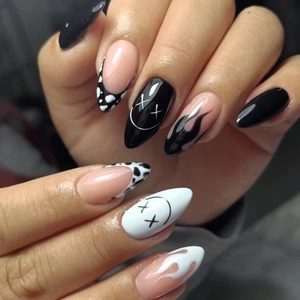 Almond Halloween press-on nails with black flame, cow print and graffiti smiley faces
