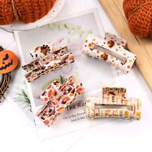 Cute turkey and pumpkin autumn claw clips with festive fall and Thanksgiving patterns