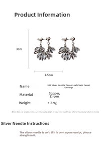 Macro shot of zircon leaf earrings showing 3cm length and 1.5cm width dimensions