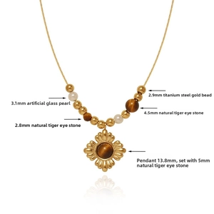 Detailed shot of sunflower pendant with tiger eye beads and gold plated chain