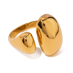Polished gold stainless steel open ring with teardrop and pebble motifs on white background