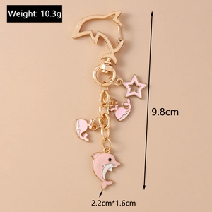 Detailed view of pink dolphin keychain with dimensions and weight 10.3g shown