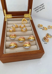 Macro detail of 18K gold plated copper rings with micro-pave cubic zirconia crystals