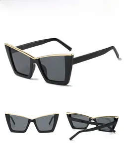 Three-view display of cat-eye sunglasses with gold metal trim and grey lenses