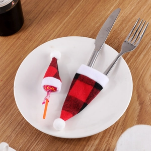 Christmas red plaid cutlery hats and lollipop decoration set on festive wooden table