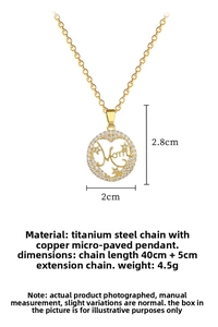 Detail of gold Mom heart pendant with sparkling crystals and titanium steel chain