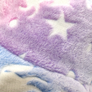 Detailed macro shot of soft tie-dye faux fur texture on a warm winter bucket hat