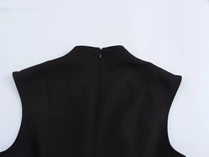 Detail shot of the back neckline showing high-quality invisible zipper on a black mini dress