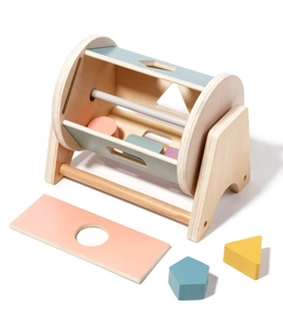 Detail of wooden shape sorter drum and colorful blocks for toddler fine motor skills