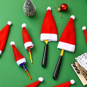 Mini red and white Christmas hat silverware holders for festive table decorations