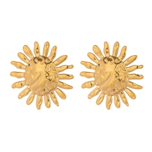 Detailed close-up of golden sun-shaped stud earrings with vintage hammered metal texture