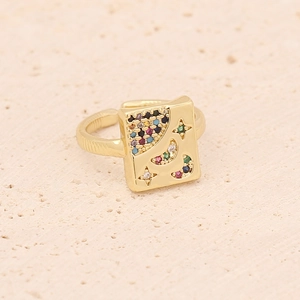 Detail of adjustable gold ring featuring a square face with star and moon zircon inlay