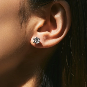 Classic 1 carat moissanite s925 sterling silver crown stud earring shown on an ear